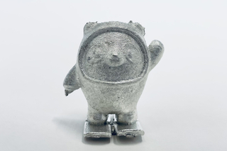 A shiny metal cast of Bing Dwen Dwen, a happy panda on skis that served as the mascot for the Beijing winter olympics